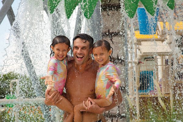 Father and daughters at Splash Park