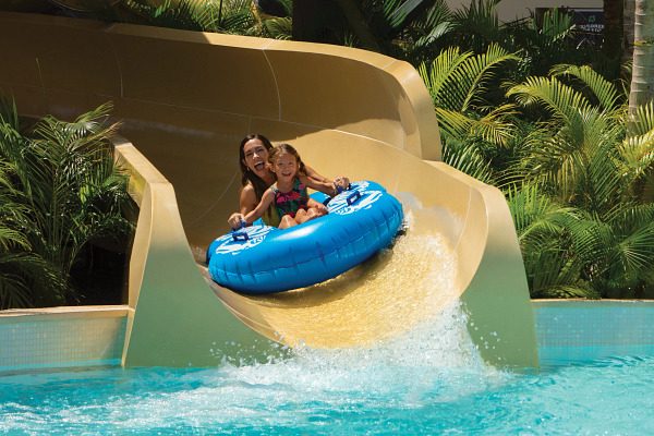Mother and daughter on water slide